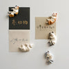 A set of six fridge magnets featuring various designs of lazy cats in different poses and colors.