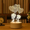 A white acrylic night light featuring three heart-shaped cutouts of cartoon characters with glowing LED lights.