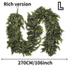 A lush green cedar garland with flexible branches shown in a vertical orientation.