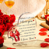 A clear heart-shaped acrylic keepsake with a red bird design and the text I love you