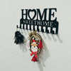 Black metal sign with the words HOME SWEET HOME and decorative hooks for a wall display
