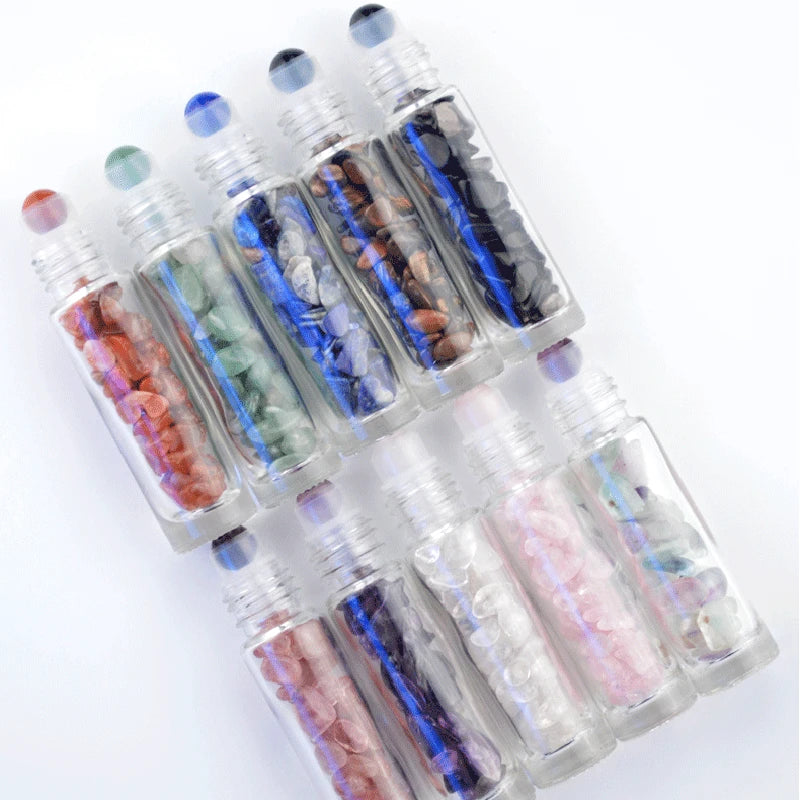 A set of ten clear glass roll-on bottles filled with various colored semi-precious stone roller balls.