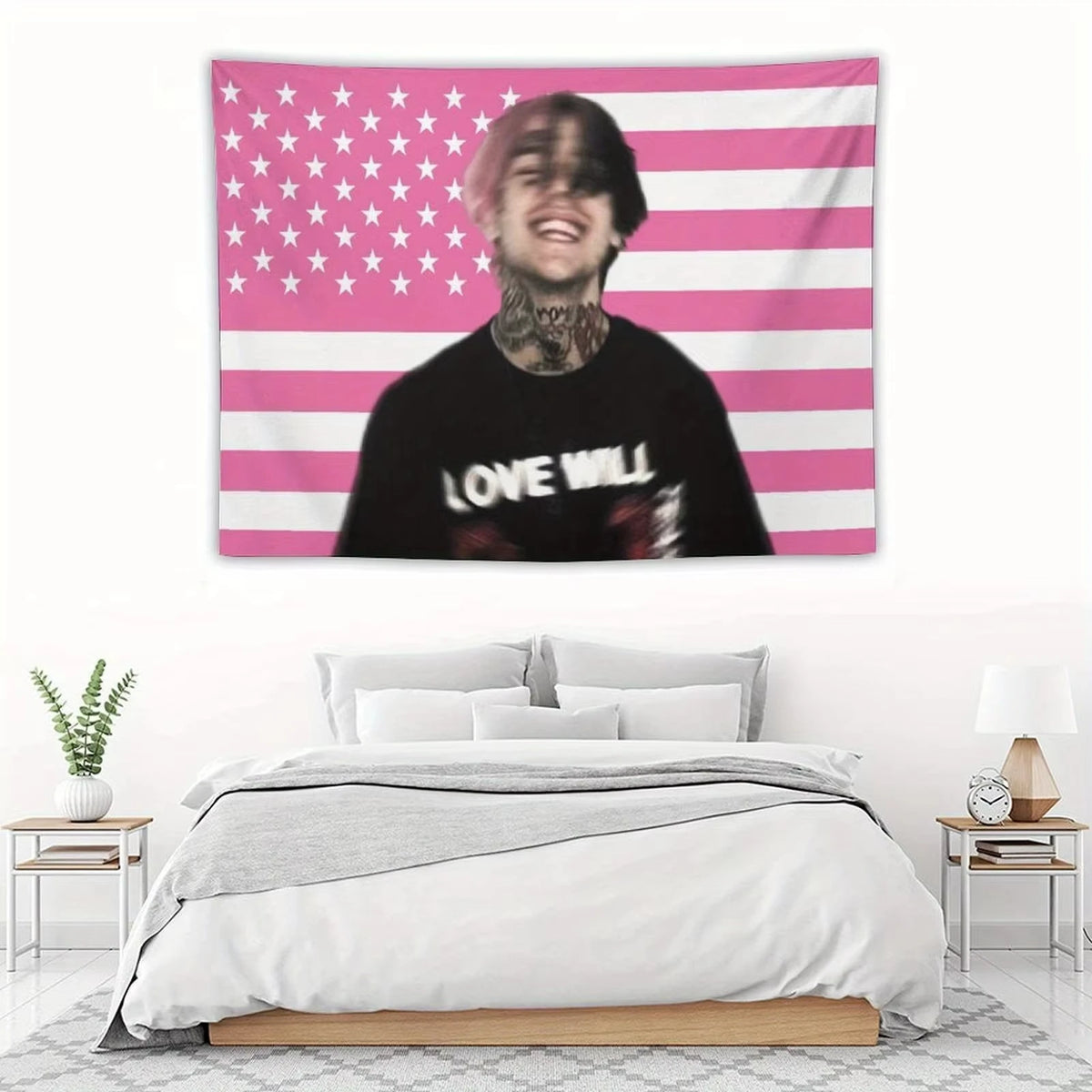 A tapestry featuring a pink and white American flag design with a man's face in the center.