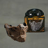 A tactical silicone half-face mask in brown and black is displayed next to a pair of black goggles and its packaging.