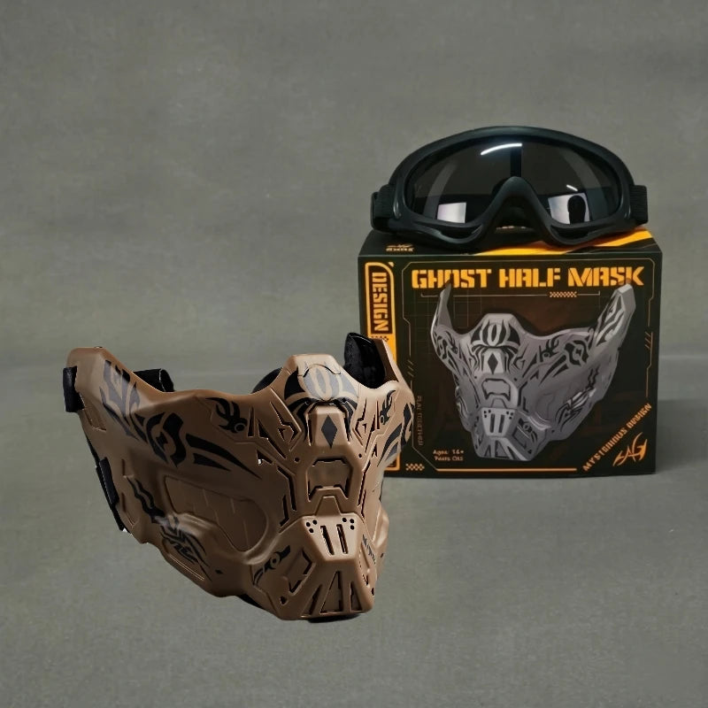 A tactical silicone half-face mask in brown and black is displayed next to a pair of black goggles and its packaging.