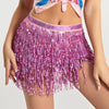 A woman wearing a sparkly purple hula dancer skirt with tassel belts and a colorful top.