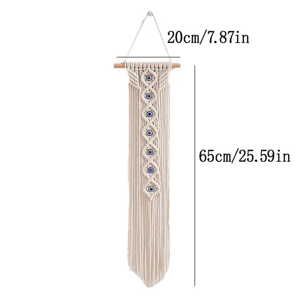 Beige macrame wall hanging with a fringe and an evil eye pendant