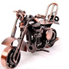A handcrafted metal motorcycle model with brass and black components displayed against a white background.