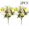 Two artificial silk bouquets featuring yellow and white roses and daisies.