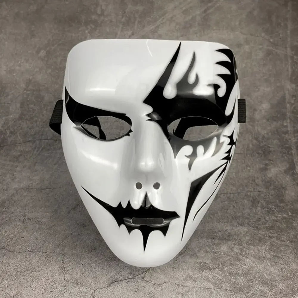 A white masquerade mask with black, stylized tribal or Hanfu-inspired markings.