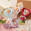 A collection of handmade crochet flower bouquets in various pastel colors, including pink, blue, and yellow, displayed on a l