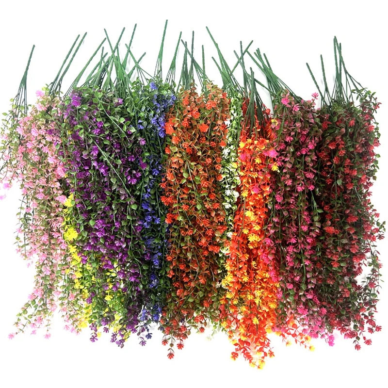 A vibrant display of artificial morning glory hanging flowers in purple, blue, orange, and pink hues.