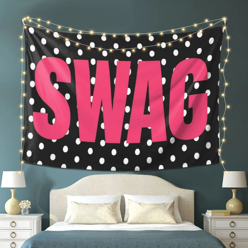 A pink polka dot tapestry with the word SWAG displayed on a dark background, hanging above a bed.