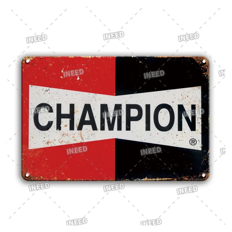 A vintage metal sign with a red and black background featuring the word CHAMPION in white text.