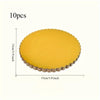A set of ten round yellow disposable cake plates with a scalloped edge.