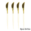 Eight disposable gold knives with white handles