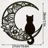 Black silhouette of a cat sitting within a decorative crescent moon cutout for wall decor