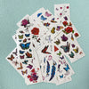 A collection of 30 waterproof temporary body art stickers featuring various colorful butterflies and floral designs.