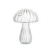 Clear glass vase shaped like a mushroom with ribbed texture