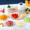 A collection of finely minced vegetables and garlic in various colors, including red, green, yellow, and white, displayed on 