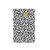 A black and white leopard print card cover featuring a gold embossed card design.