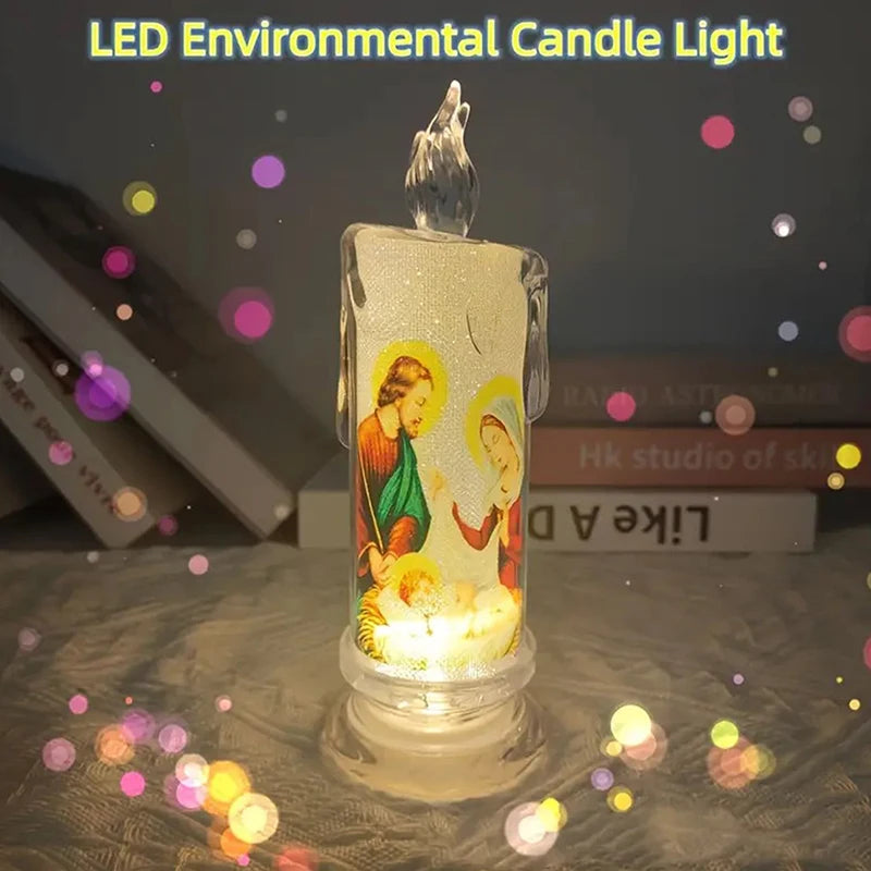 A clear glass candle light featuring a flame-like topper and an etched religious figure, set on a surface with scattered ligh