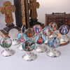 A collection of retro Catholic tabletop ornaments featuring religious figures and crosses.