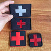 Three tactical morale patches featuring a medical cross symbol in white, red, and black.
