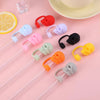 Assortment of reusable silicone straw covers in various colors including red, purple, white, black, green, and orange.