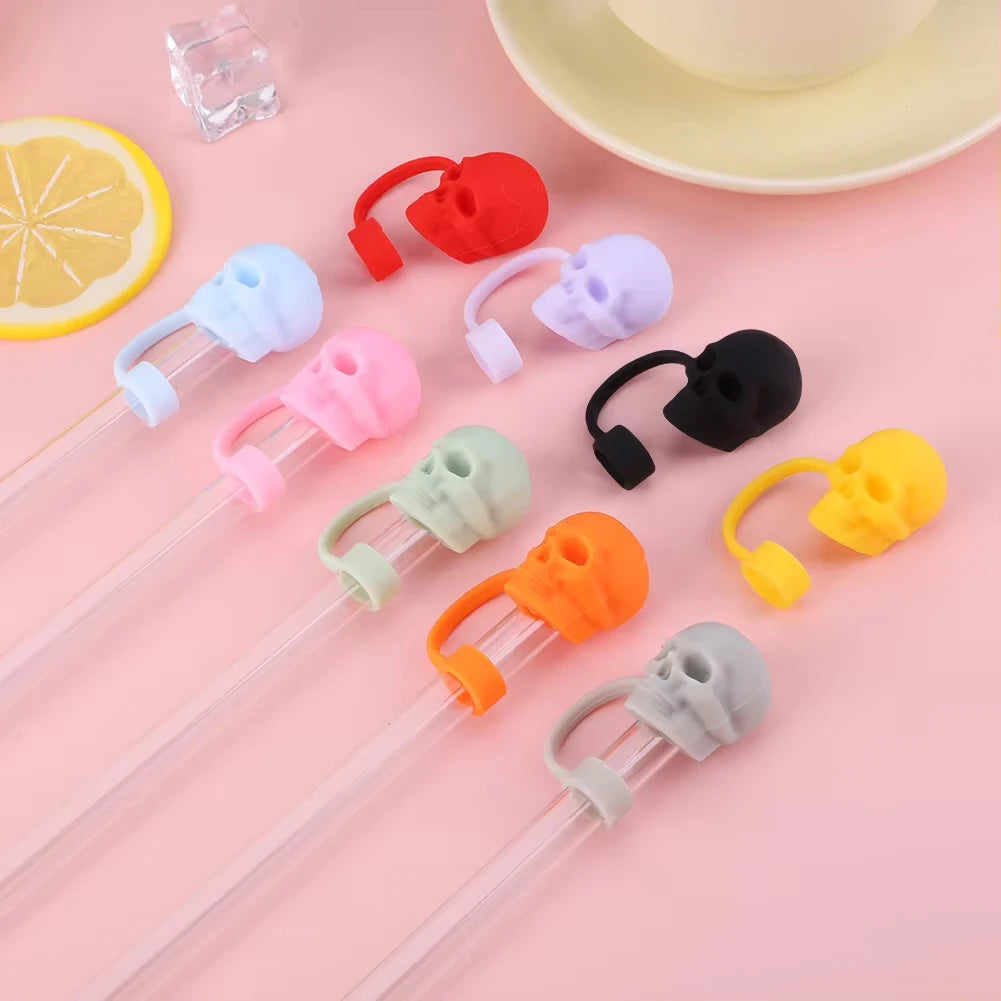 Assortment of reusable silicone straw covers in various colors including red, purple, white, black, green, and orange.