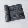 Roll of 3D wood grain self-adhesive wallpaper featuring dark gray and black stripes.