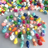 Assorted resin miniature figurines in various colors and shapes for DIY decor