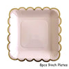 Eight 9-inch disposable plates with a scalloped gold and pink edge.