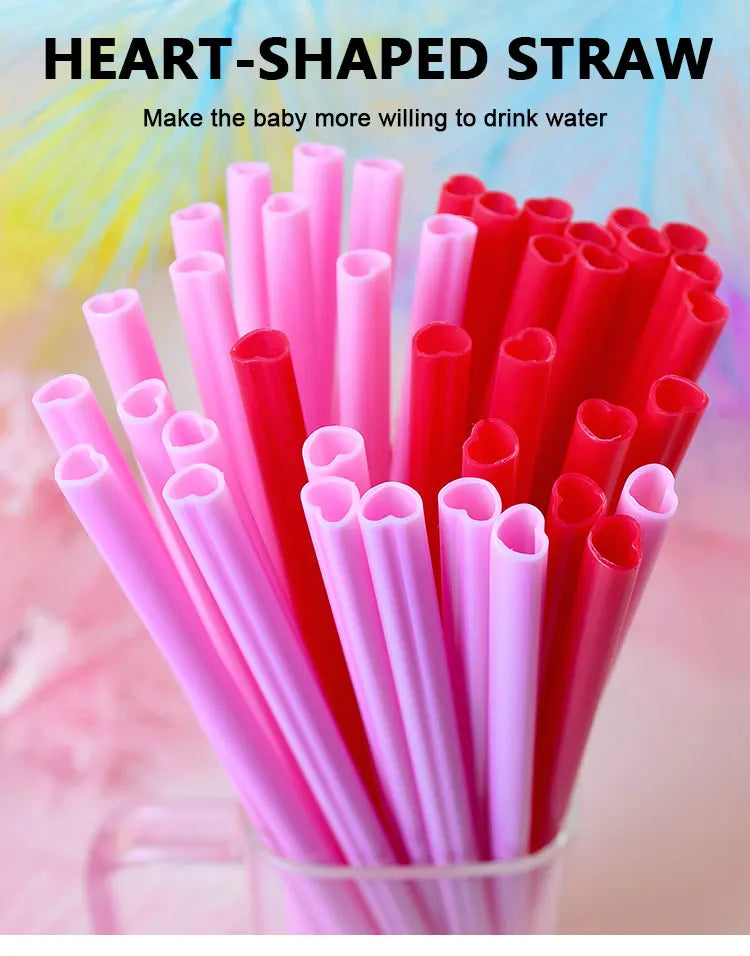 A close-up view of a large pack of heart-shaped pink disposable straws in various shades of pink and red.
