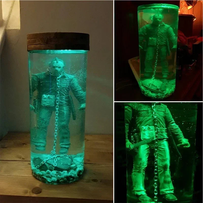 A collectible lamp featuring a figure resembling Jason Voorhees submerged in glowing green liquid inside a glass container.