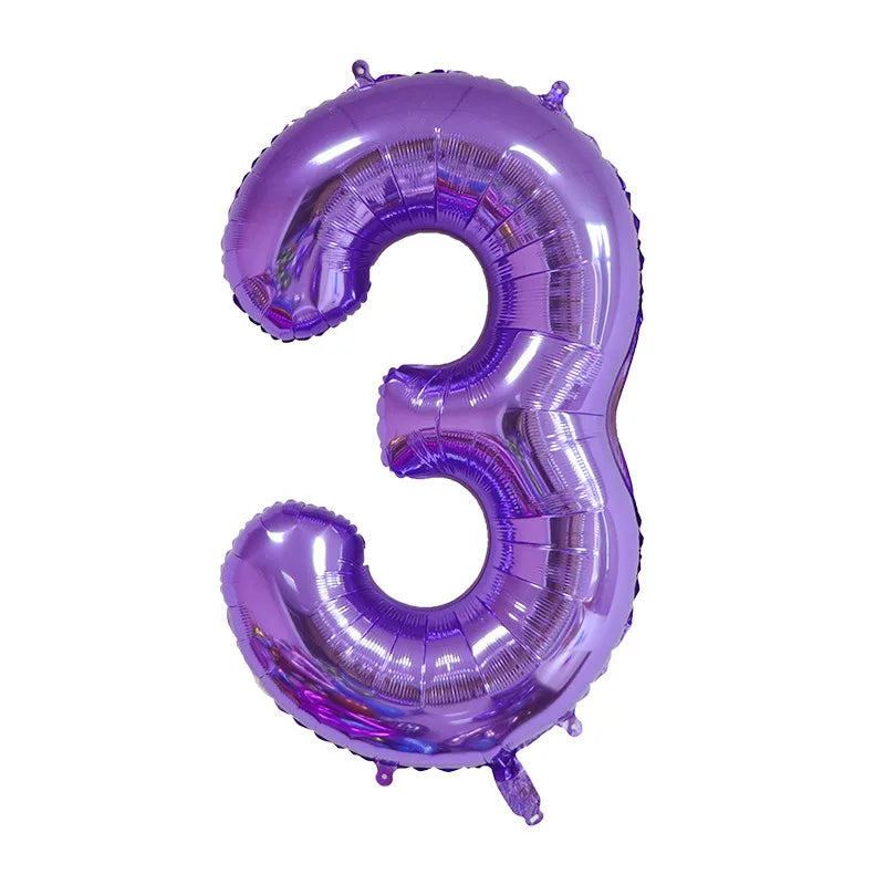 A purple foil balloon shaped like the number three for celebrations.