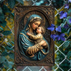 A bronze-toned metal sign featuring a sculpted relief of the Virgin Mary holding the infant Jesus.