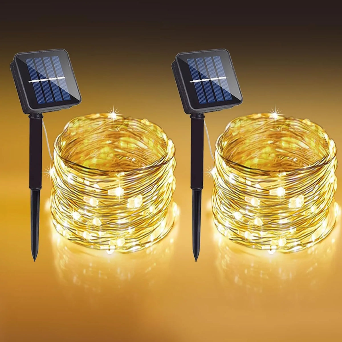 Two sets of solar-powered outdoor string lights with solar panels illuminating a golden light display.