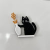 Black magnetic acrylic cat whiskers decor with a white ceramic vase and gold accents