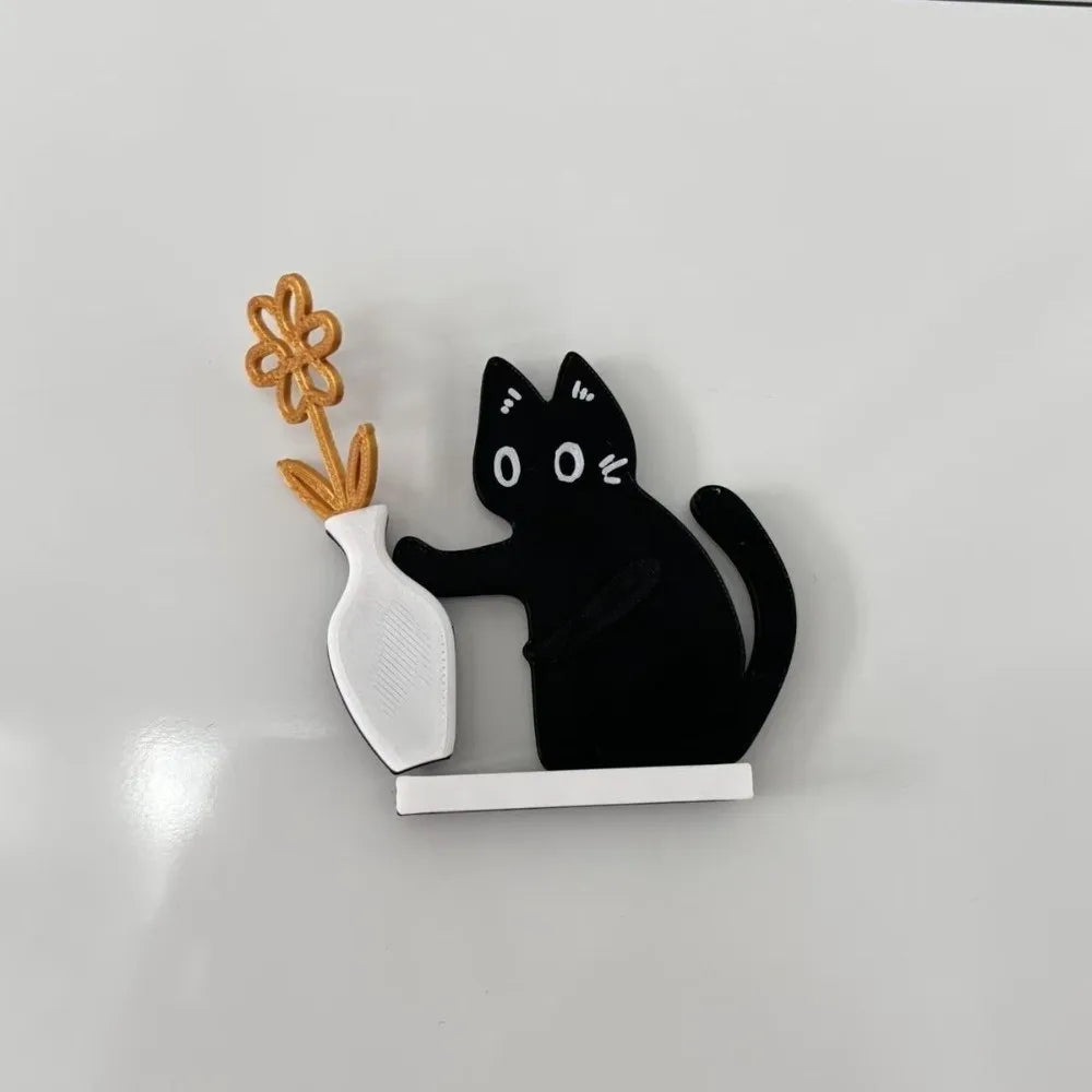 Black magnetic acrylic cat whiskers decor with a white ceramic vase and gold accents