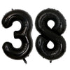 A set of two giant black foil balloons shaped like the number 38