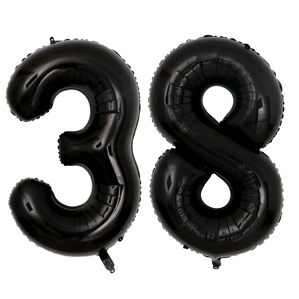 A set of two giant black foil balloons shaped like the number 38