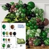 Collection de ballons en feuille verte, noire et marron, disposés en forme de couronne sur fond camouflage.