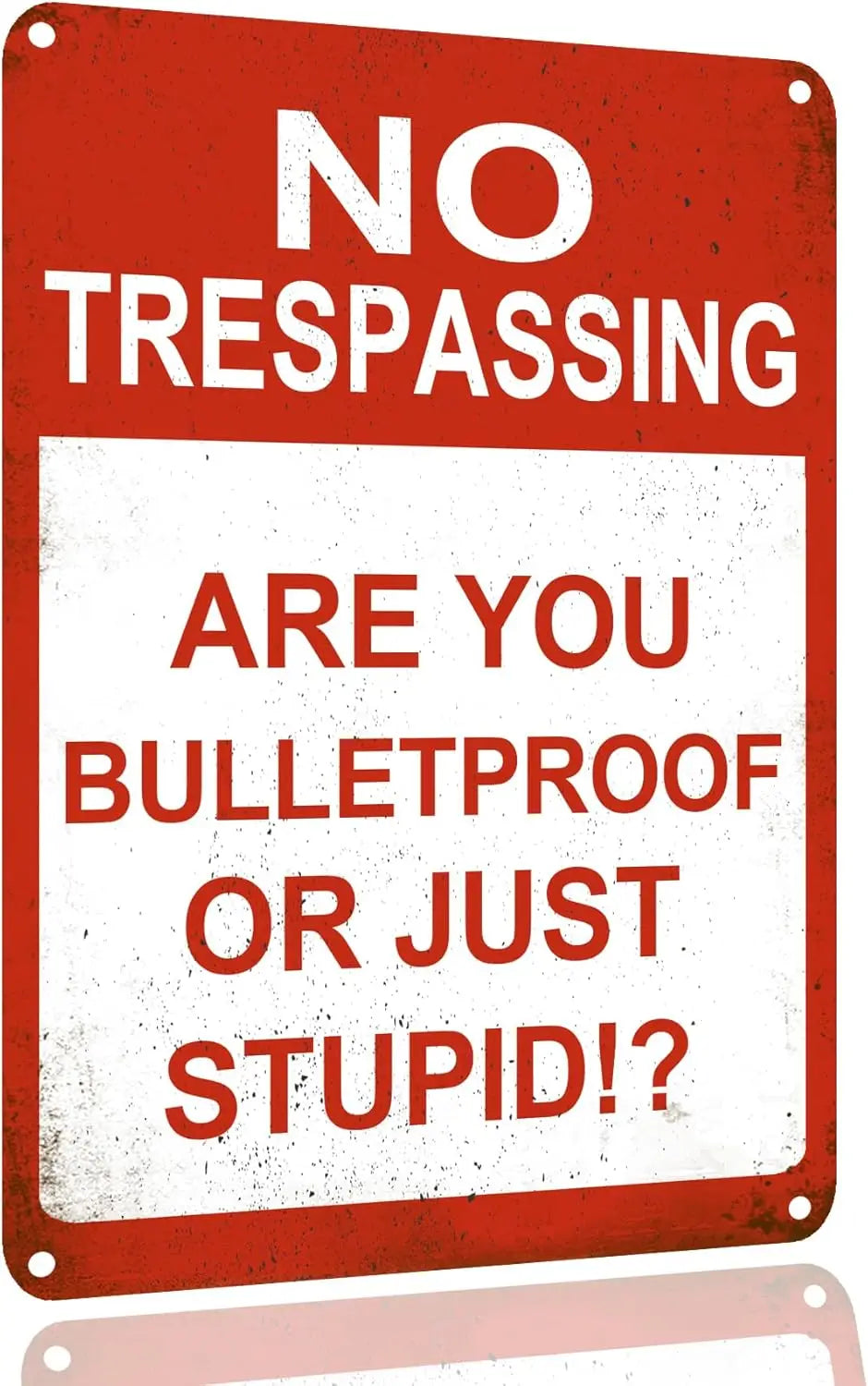 A red metal sign with white text that reads NO TRESPASSING ARE YOU BULLETPROOF OR JUST STUPID?