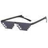 A pair of dark gray pixel mosaic sunglasses with black frames and UV400 protection.