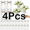 Four clear faceted diamond crystal plastic vases with natural twine accents.
