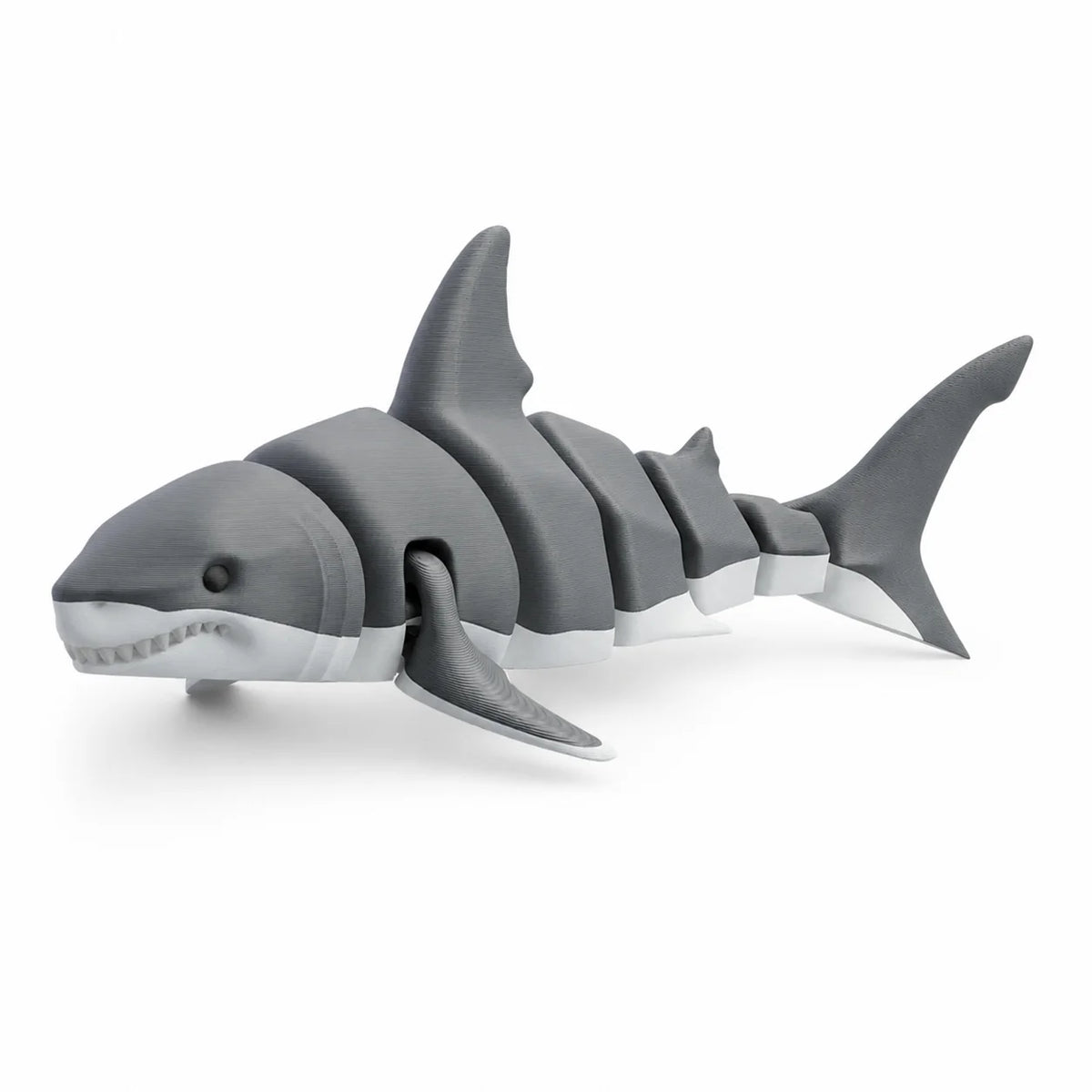 A set of gray articulated ocean animal figurines showing various shark-like shapes.