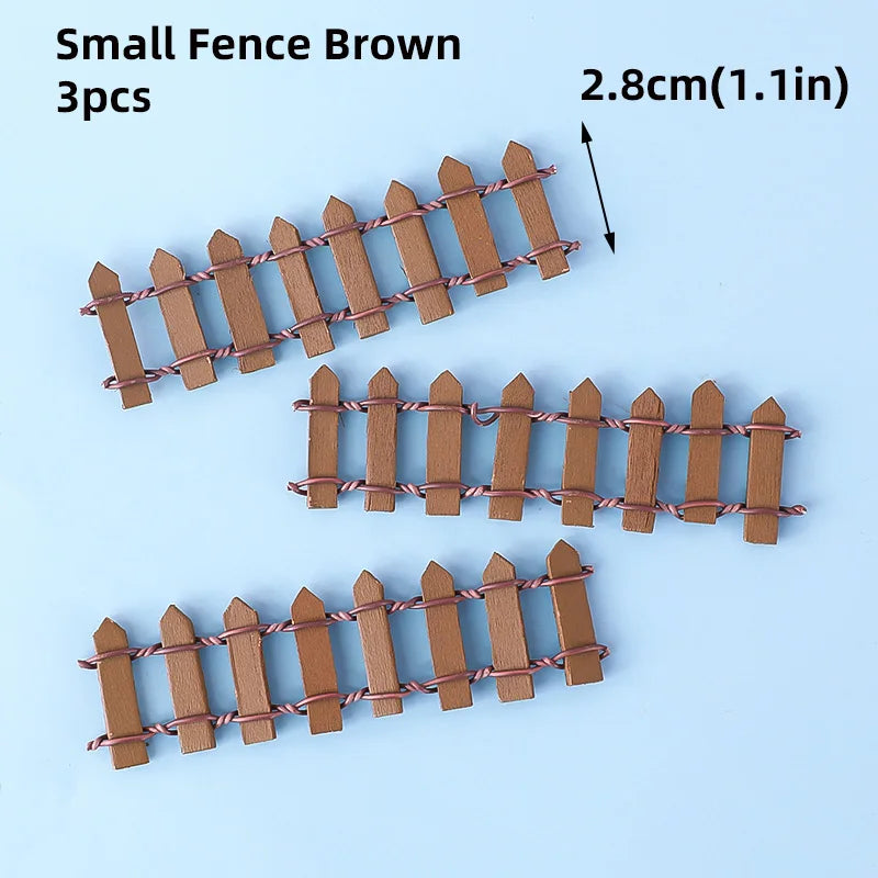 Three small brown picket fence cake toppers, 2.8cm long.