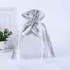A clear silver festive drawstring gift bag tied with a large bow, set against a white background.