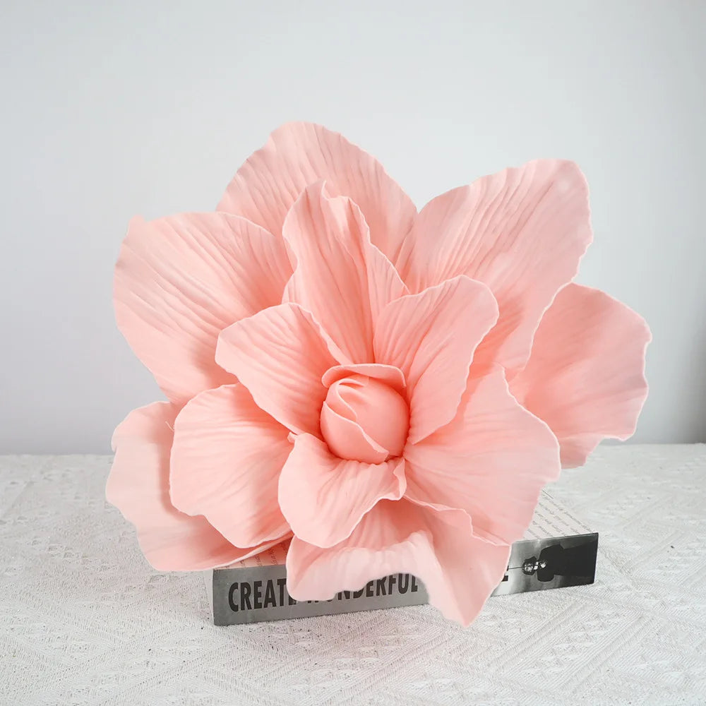 A bouquet of large, peach-colored foam rose flowers used for wedding and party decoration.